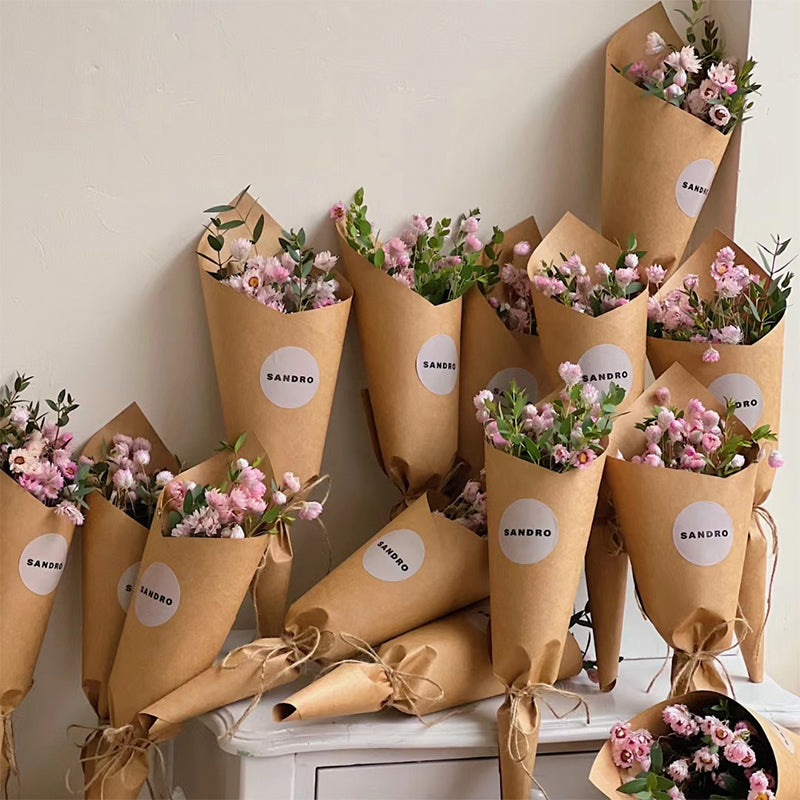 wrapping flowers in brown paper