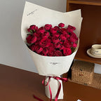 flowers wrapped in brown paper
