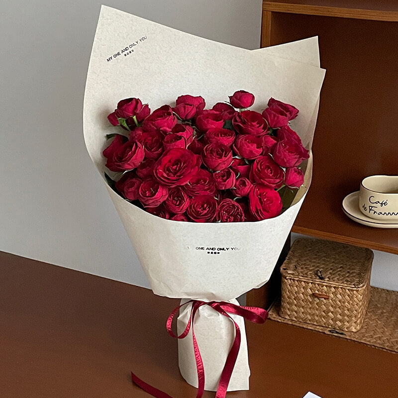 flowers wrapped in brown paper