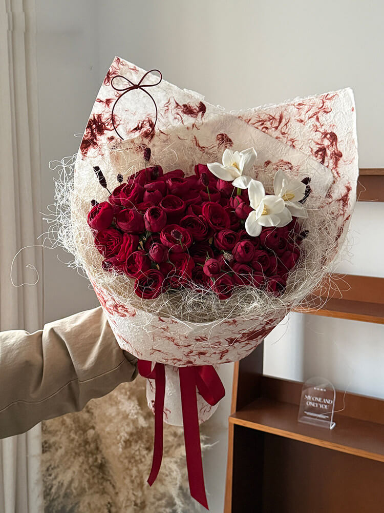 wrapping flowers in paper bag