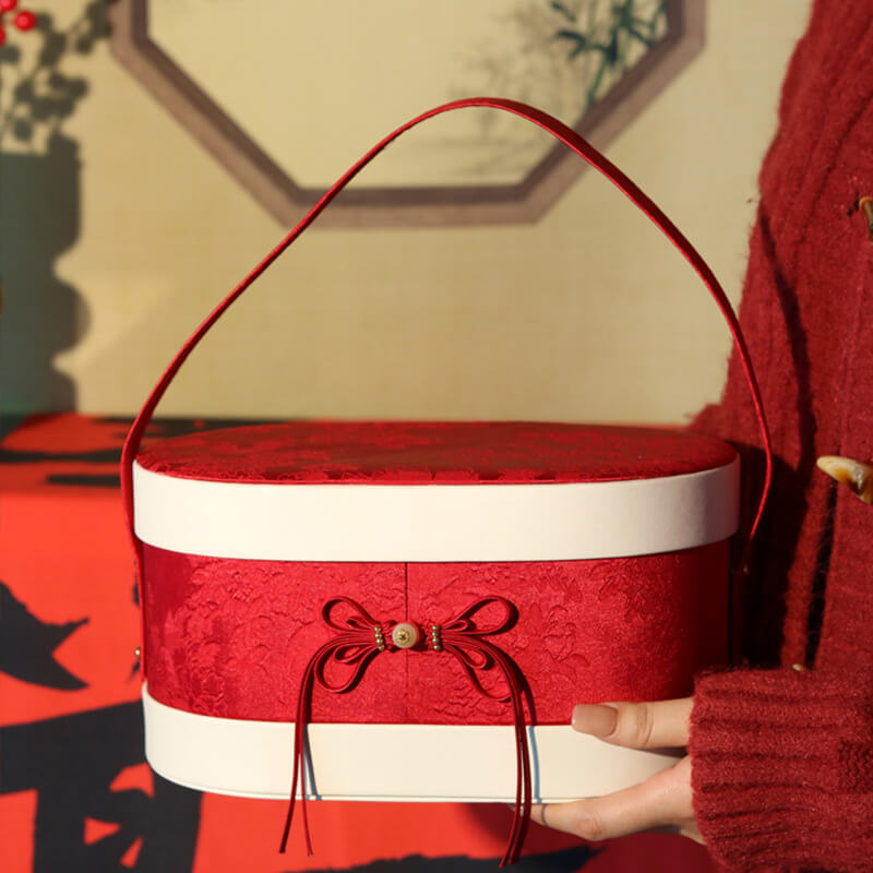 Chinese Leather and Brocade Oval Gift Box
