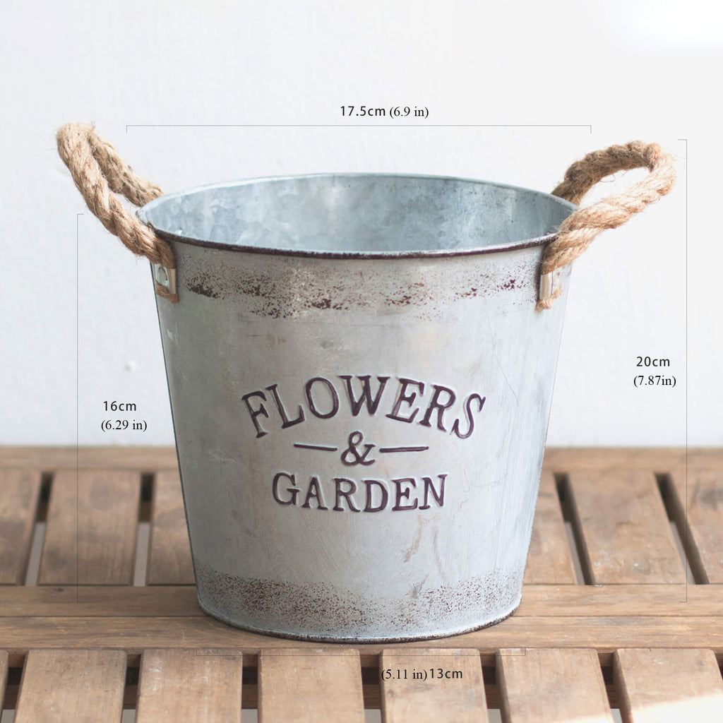 flowers in metal buckets