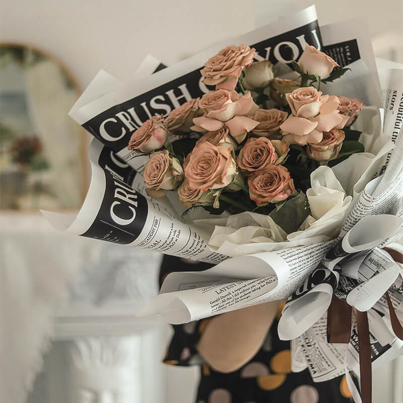 newspaper wrapped flowers